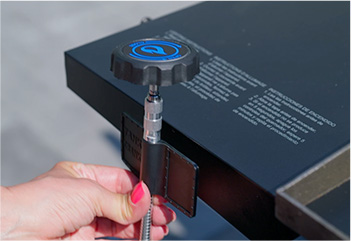 Handy Grill Tank Crank sticks to the side of your grill